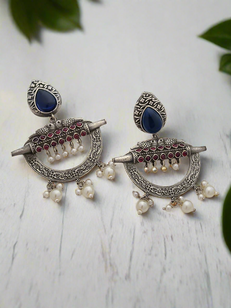 Oxidized earrings in traditional motifs