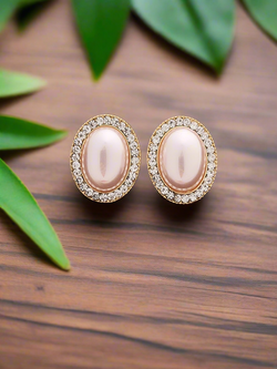 Classic pearl studs with diamonds