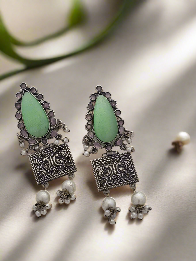 Traditional oxidized earring embellished with stones and pearls