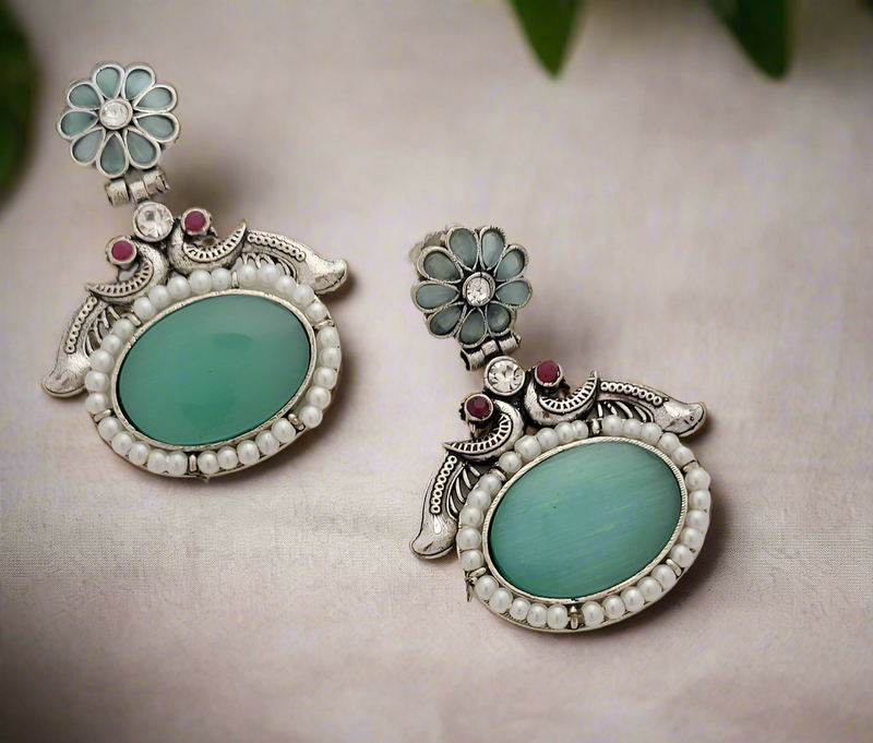 Oxidized Peacock motif earrings with big center stone