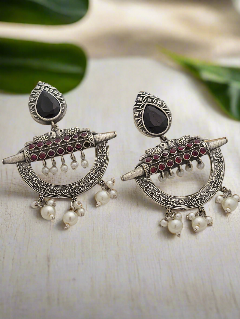 Oxidized earrings in traditional motifs